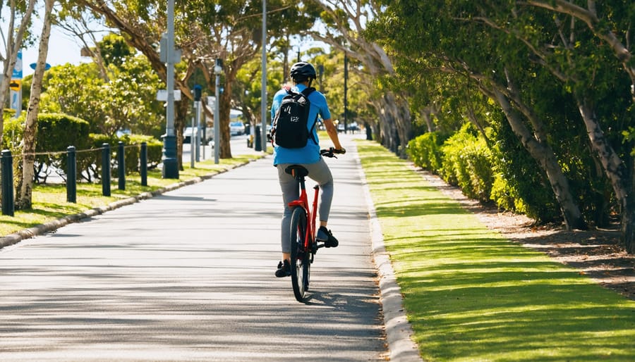 Cyclist commuting on an electric bike using a dedicated bike lane in an urban environment